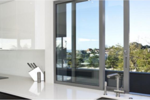 PRM-150 Series aluminum sliding window with outdoor view in modern interior