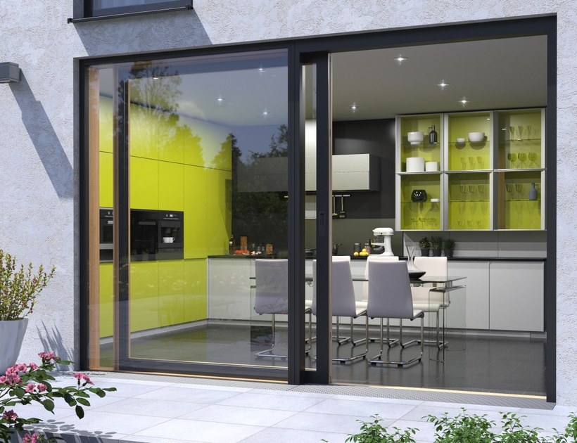PRM-202 Series aluminum sliding door opening to modern kitchen and dining