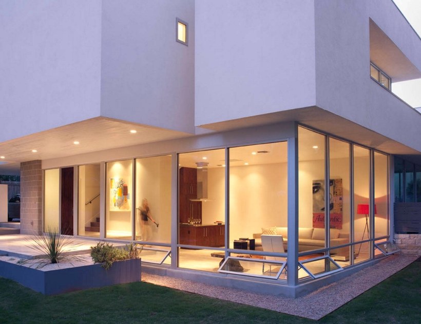 PRM-55 Series aluminum awning windows on modern house exterior at dusk