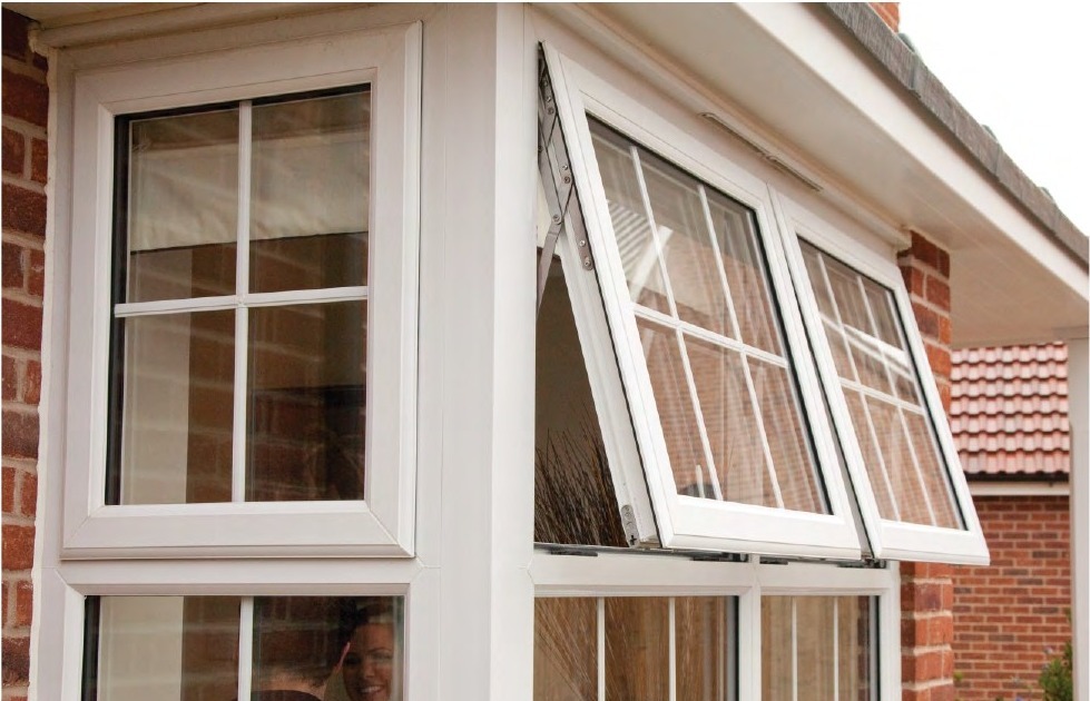 uPVC awning windows open on brick exterior, outward-hinged sash visible