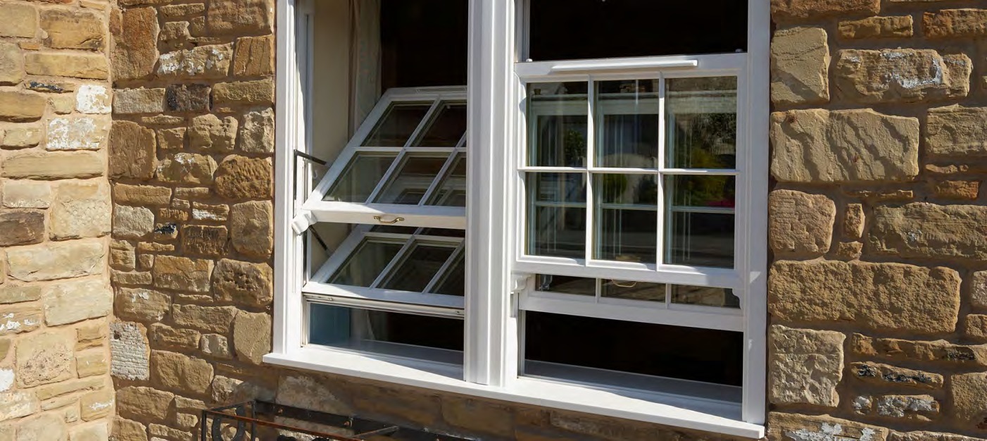 uPVC hung windows installed on stone exterior