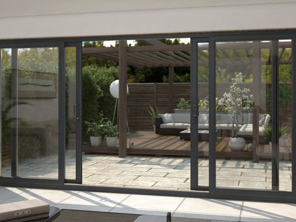 PRM-114 Series uPVC sliding door in dark gray on white brick exterior