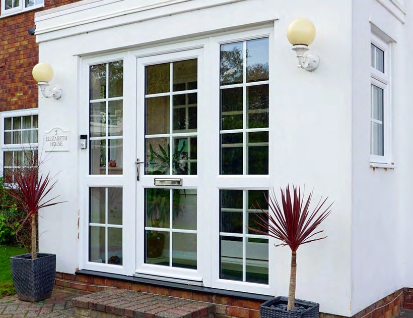 PRM-60 Series uPVC casement door with glazing on residential exterior